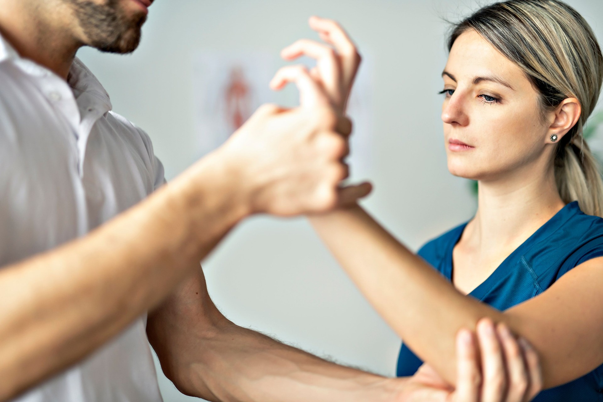 A Modern rehabilitation physiotherapy man at work with woman client